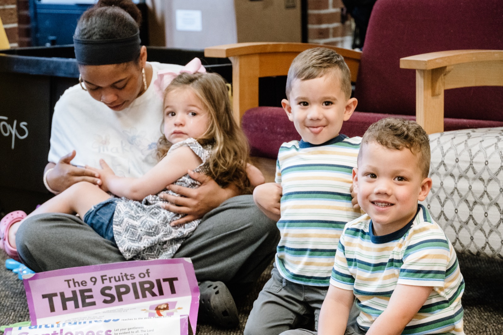 CRWC Kidz children learning about the fruit of the Spirit with a caring leader